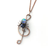 Lyri treble clef spider necklace