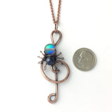 Lyri treble clef spider necklace