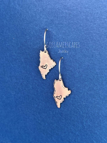 Lewiston Strong! Solid copper shaped like the state of Maine with a heart stamped into the lower left side.  The shapes hang from simple titanium ear wires.