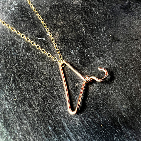 Rose gold filled coat hanger pendant on a yellow gold filled chain